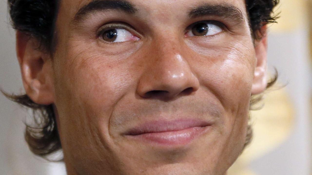 Spain's tennis player Rafael Nadal poses before receiving the Vermeil Medal of the City of Paris on May 21, 2015 in Paris. AFP PHOTO / PATRICK KOVARIK