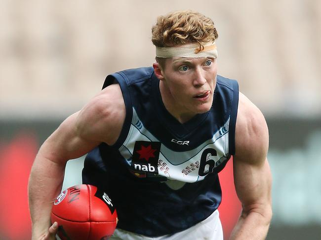 MELBOURNE, AUSTRALIA - JUNE 01: A bandaged up Matthew ROWELL of Vic Metro runs with the ball during the U18s match between Vic Metro and Vic Country at Melbourne Cricket Ground on June 01, 2019 in Melbourne, Australia. (Photo by Michael Dodge/Getty Images)