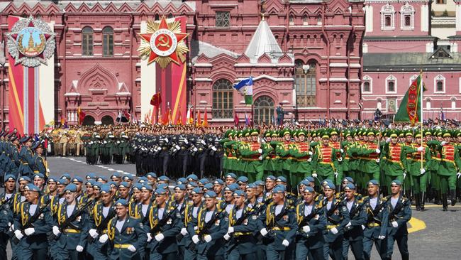 Turkmenistan servicemen, centre right, attend the Victory Day military parade in Moscow. Picture: AP/Alexander Zemlianichenko
