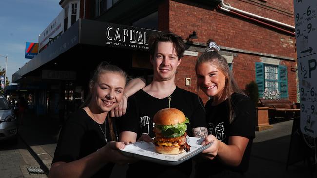 Burger Haus restaurant manager Chelsea Nuss, sous chef Shane Roockley and waitress Chloe Paynter in North Hobart. Picture: NIKKI DAVIS-JONES