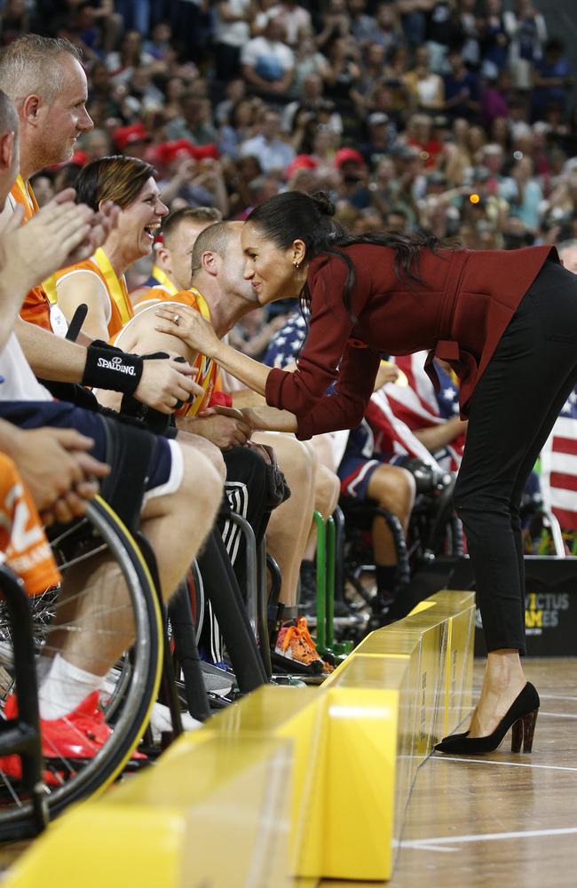 Meghan, Duchess of Sussex at the Invictus Games Wheelchair Basketball gold medal game, where she kissed a player on the cheek. Picture: Richard Dobson