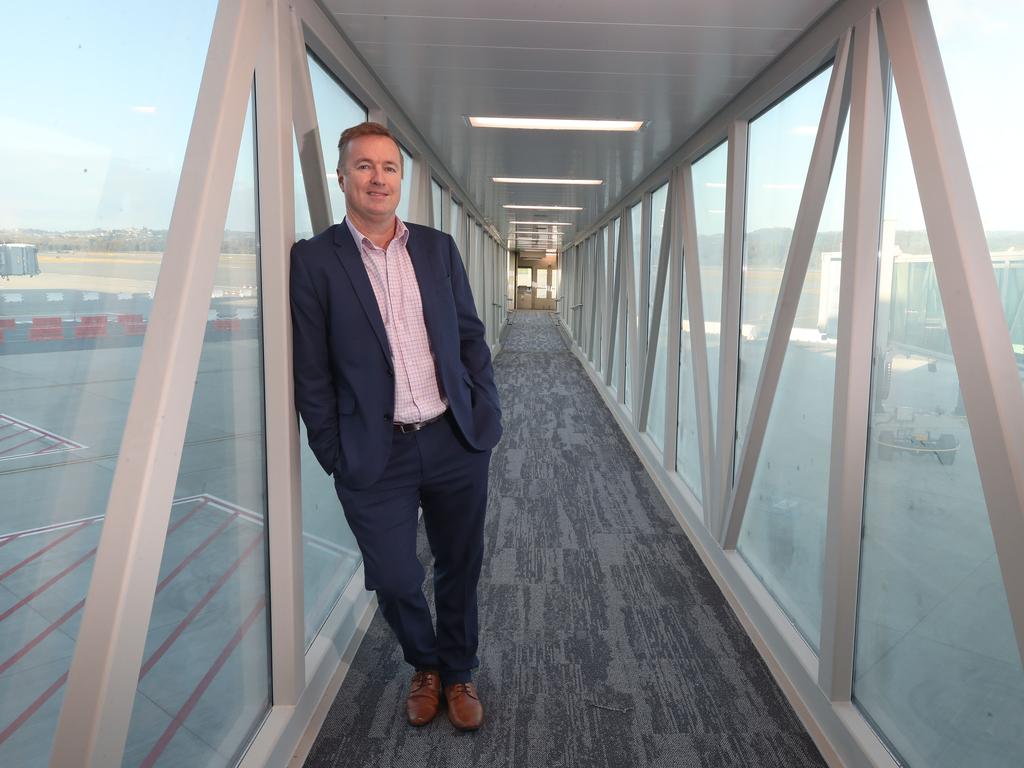 Queensland Airports Limited CEO Chris Mills at one of the new aerobridges. Picture: Glenn Hampson.