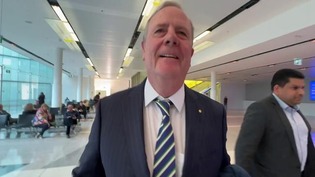 06/06/2024: Stills taken from vision of reporter for The Australian, Liam Mendes approaching NINE chairman Peter Costello at Canberra airport. Costello shoulder barges Mendes where he subsequently falls to the ground. Picture: Liam Mendes