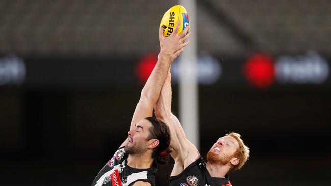 Brodie Grundy of the Magpies and Andrew Phillips of the Bombers in action during the 2020 AFL Round 05 match between the Collingwood Magpies and the Essendon Bombers. (Photo by Michael Willson/AFL Photos via Getty Images)