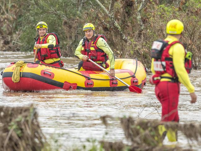 Queensland Fire and Emergency Services Swift Water Rescue check a car in floodwaters at Theuerkaufs Road, Fairney View, near Fernvale, Friday, May 13, 2022 - Picture: Richard Walker