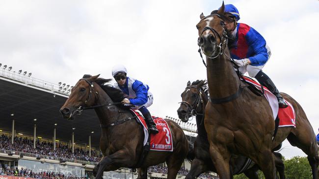 Jamie Kah riding Zaaki alongside Tim Clark on Alligator Blood in the Cox Plate at The Valley on October 22. Picture: Vince Caligiuri/Getty Images