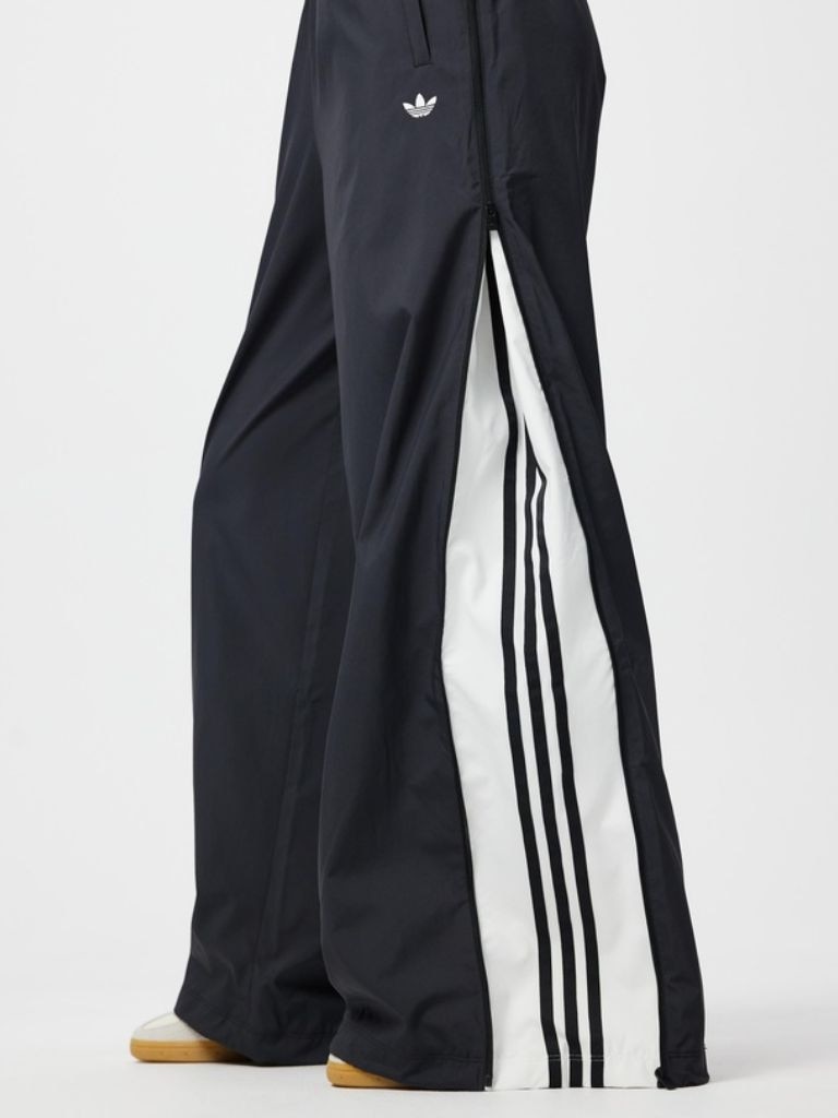 Unzipped at the side, the iconic Adidas stripes are revealed. Picture: The Iconic