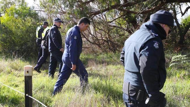 Police search bushland in Cranbourne for Brendon Farrell last week. Picture: David Crosling