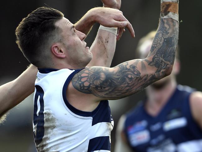 Macedon’s Jason Cooke keeps his eye on the ball. Picture: Andy Brownbill