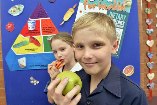 Elsa Helander and Zac Collins take a bite of their healthy lunches. . Picture: Kevin Farmer