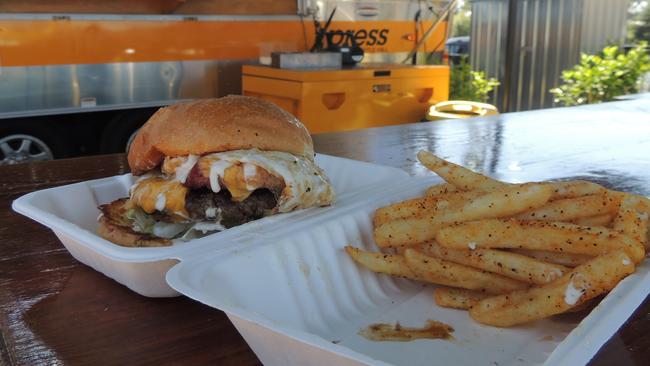 Xpress Burger ($14) with an all beef patty, egg, bacon, American cheese, tomato, onion and aioli served with chips from Xpress Cafe in Castle Hill. Picture: Bev Jordan