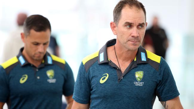 Australian head coach Justin Langer arrives to address the media at Adelaide airport before flying to Perth for the second test against India. Picture: Kelly Barnes