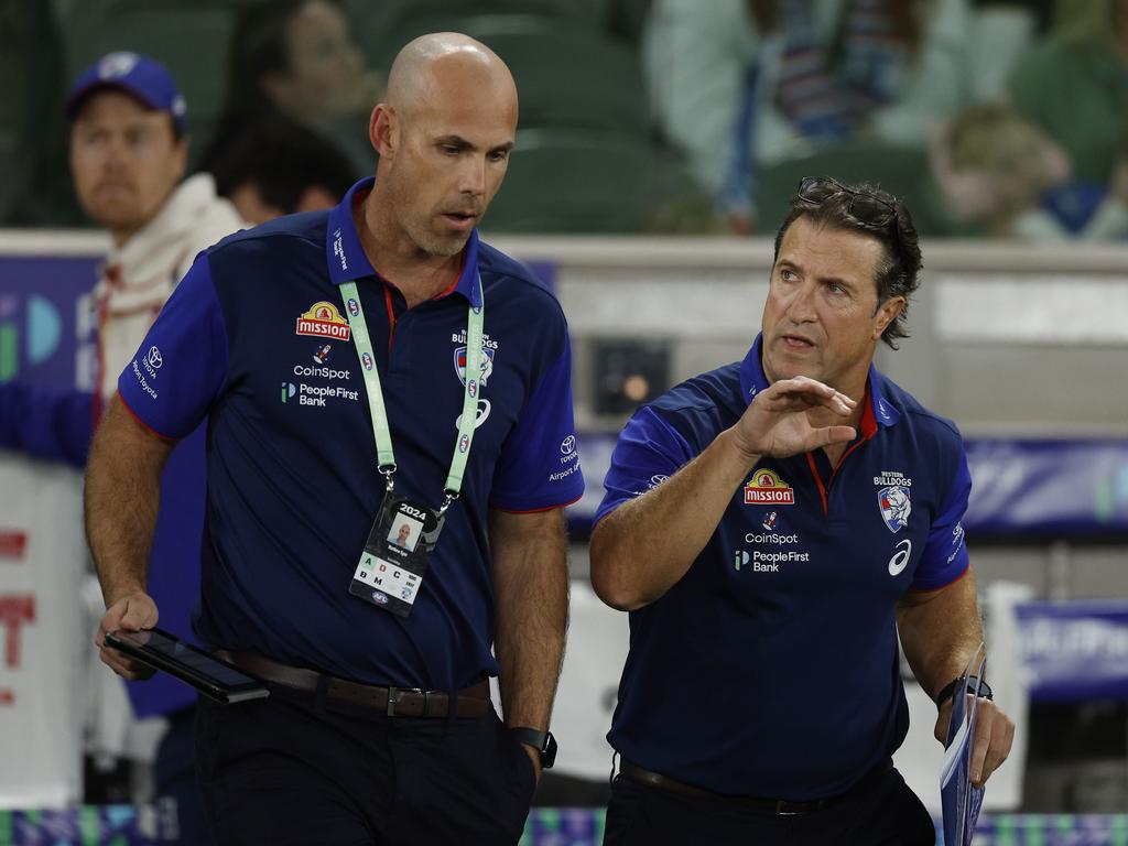 Luke Beveridge chats with assistant Matthew Egan during the Dogs loss to the Hawks. Picture: Michael Klein