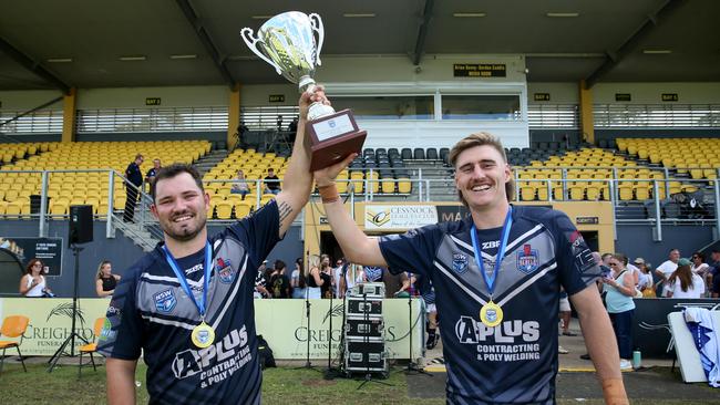 Newcastle skipper Chad O’Donnell and man of the match Cameron Anderson celebrate with the trophy. Picture: Sue Graham