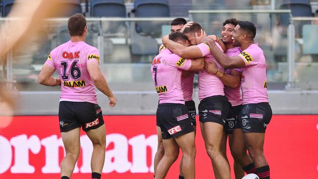 Mavrik Geyer of the Panthers celebrates scoring a try with teammates during the NRL trial match against the Cronulla Sharks. (Photo by Brett Hemmings/Getty Images)