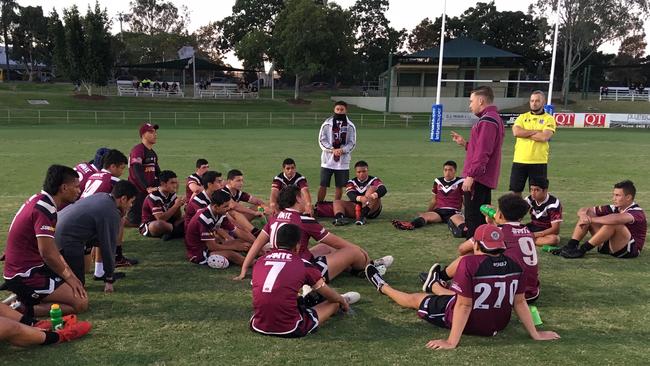 Marsden State High School Walters Cup players listen to coach Matthew Hartigan.