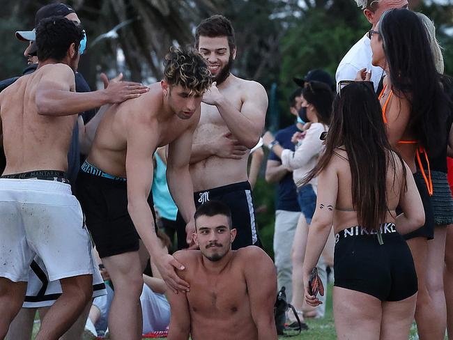 Crowds flocked to St Kilda beach as the temperature hit 27 degrees.Social distancing and not wearing of masks was common as Melbourne battles a second wave of coronavirus. Picture : Ian Currie