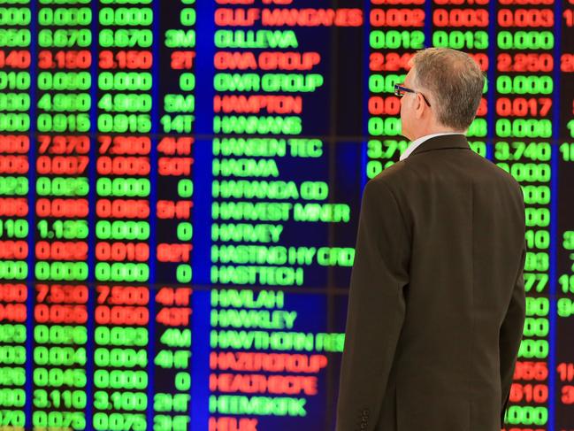 A trader pictured at the front of the ASX Board in Sydney.Picture: Christian Gilles