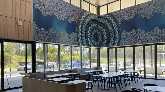 Mullaway-based Gumbaynggirr artist Tulli Stevens’ piece ‘Gawbarri’ can be seen on different surfaces throughout the complex, including a huge colour print in the foyer and cafe space. Picture: Chris Knight