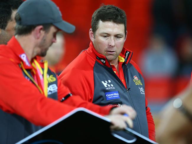 Suns coach Stuart Dew talks to his team during the round 23 AFL match between the Gold Coast Suns and the Greater Western Sydney Giants at Metricon Stadium on August 24, 2019 in Gold Coast, Australia. (Photo by Jono Searle/AFL Photos/via Getty Images)