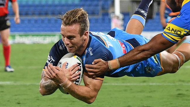 Kane Elgey of the Gold Coast Titans scores a try against the Eels.