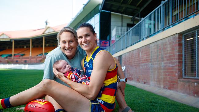 Adelaide AFLW captain Chelsea Randall, fiancee Marijana Rajcic and their newborn son, Tomi, at Norwood Oval. Picture: Matt Turner.