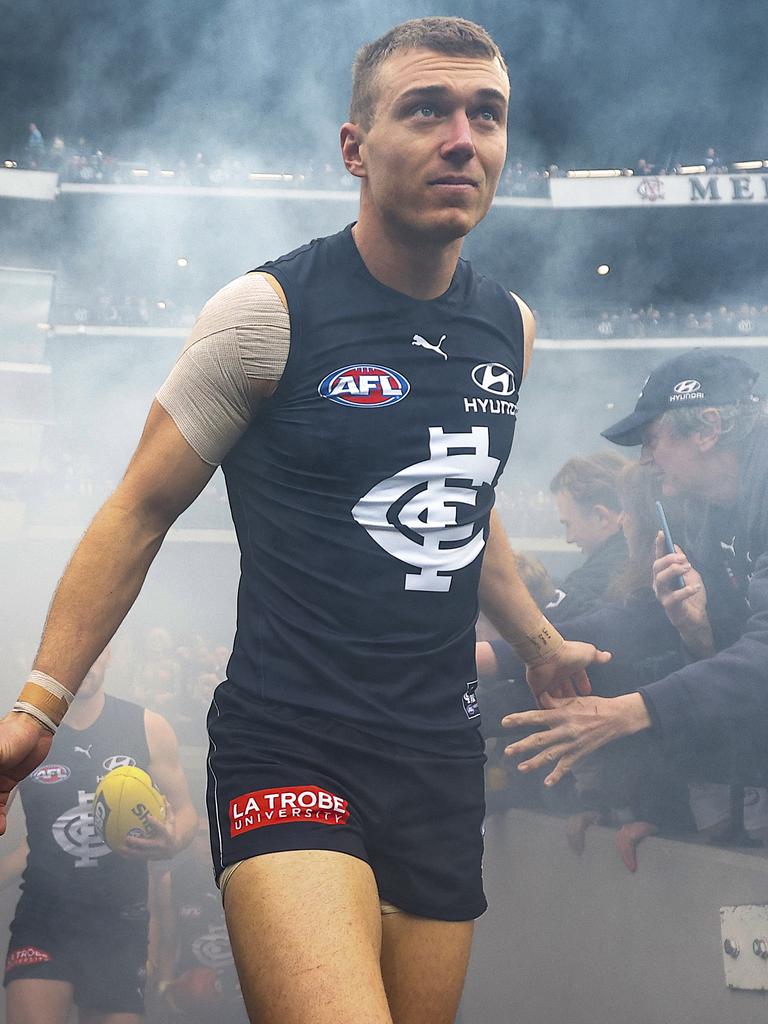 Melbourne, Australia. 02nd June, 2023. Patrick Cripps of Carlton leads  teammates from the field during the AFL Round 12 match between the  Melbourne Demons and the Carlton Blues at the Melbourne Cricket