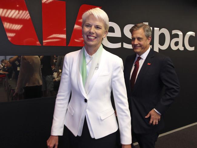 Westpac CEO Gail Kelly, left, is followed by Chief Executive Brian Hartzer as they arrive to a press conference where Kelly will announce her retirement in Sydney, Thursday, Nov. 13, 2014. Kelly, CEO of Australia's second largest bank, will hand over to Hartzer on Feb. 2, 2015. (AP Photo/Rick Rycroft)