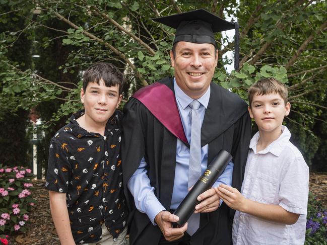 Bachelor of Electrical Engineering graduate Adam Pincham with sons Kieran (left) and Broady Pincham at a UniSQ graduation ceremony at Empire Theatres, Tuesday, February 13, 2024. Picture: Kevin Farmer