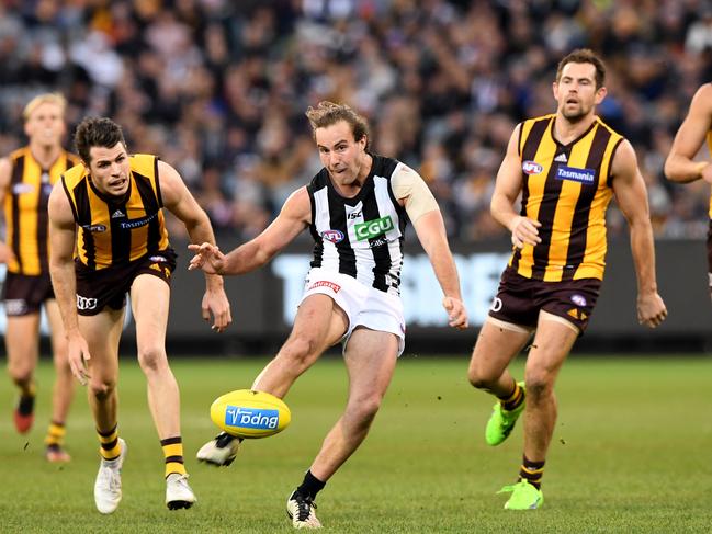 Tim Broomhead of the Magpies kicks a goal against Hawthorn. Picture: Joe Castro