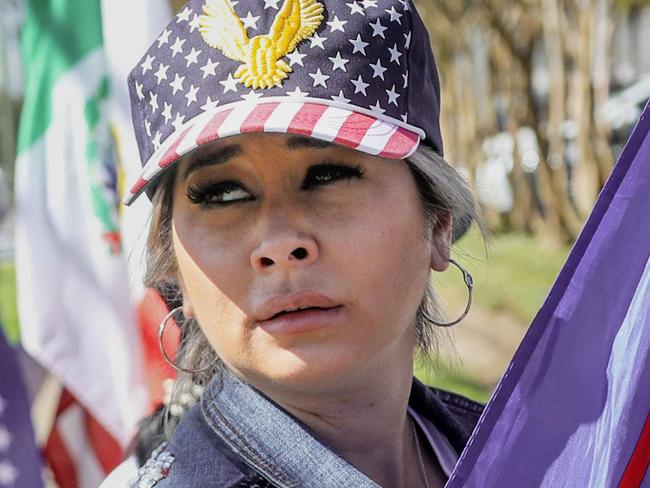 HOUSTON, TX - NOVEMBER 03: A supporter of U.S. President Donald Trump at a rally along West Gray Street on November 3, 2020 in Houston, Texas. After a record-breaking early voting turnout, Americans head to the polls on the last day to cast their vote for incumbent U.S. President Donald Trump or Democratic nominee Joe Biden in the 2020 presidential election.   Sandy Huffaker/Getty Images/AFP == FOR NEWSPAPERS, INTERNET, TELCOS & TELEVISION USE ONLY ==