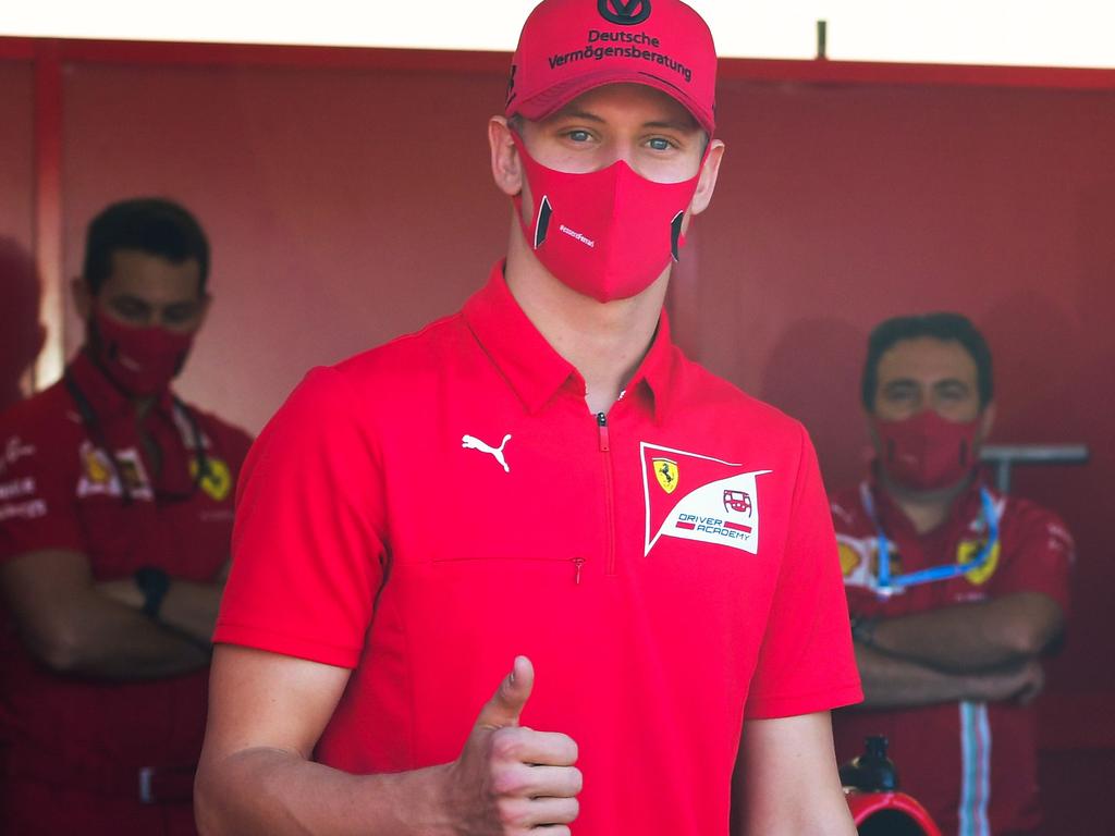 Mick Schumacher, son of former F1 champion Michael Schumacher, visits the Ferrari pit before the Tuscan Formula 1 Grand Prix.