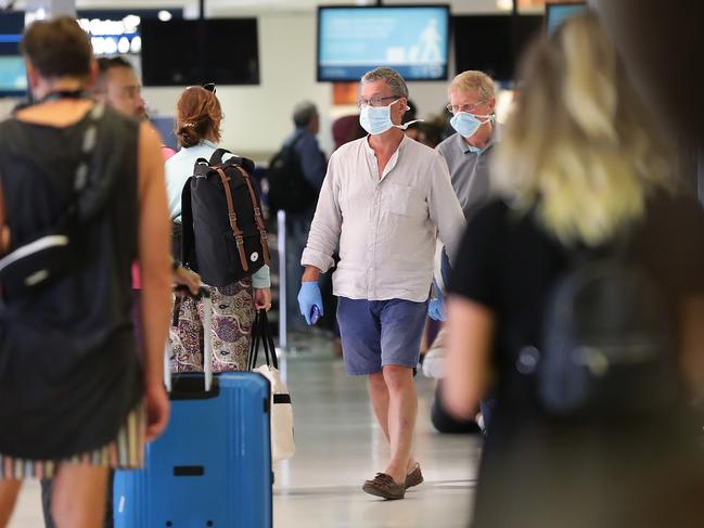 Passengers at Sydney International Airport. Online searches reveal Aussies are stressed about hand sanitiser and travel bans. Picture: Getty Images