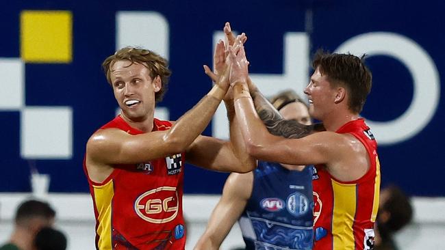 Jack Lukosius (left) and Bailey Humphrey celebrate after the Suns got off to a good start. (Photo by Michael Willson/AFL Photos via Getty Images)