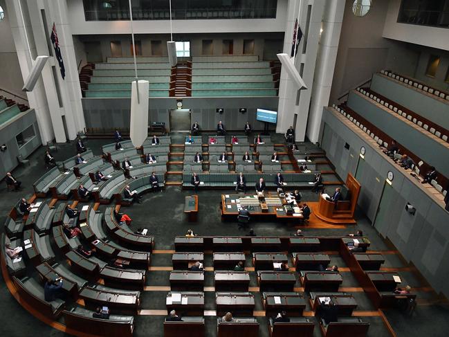 Prime Minister Scott Morrison delivers a ministerial statement on COVID-19 in a shrunk House of Representatives in Canberra, Australia. Picture: Getty Images