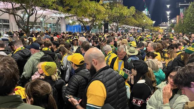 Fans waiting for the train at Olympic Park station.