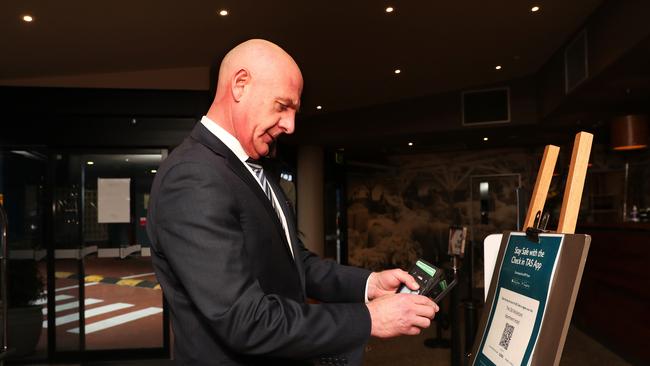 Premier Peter Gutwein uses the Check in TAS app. Picture: Nikki Davis-Jones