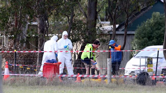 People in protective gear following the outbreak. Picture: Mike Dugdale