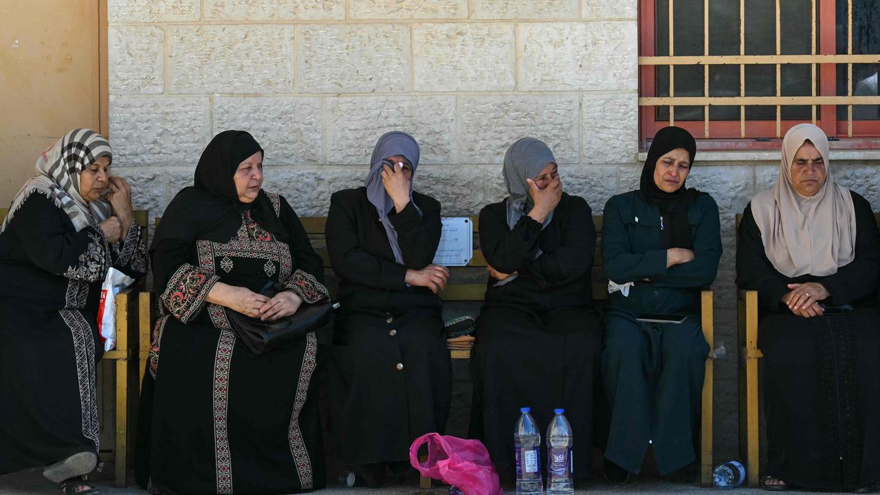 Women cry as they wait at the Tubas hospital where casualties were transported during an ongoing Israeli raid in the occupied West Bank. Picture: Ronaldo Schemidt/AFP