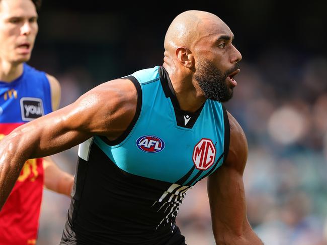 ADELAIDE, AUSTRALIA - JUNE 22: Esava Ratugolea of the Power handpasses the ball during the 2024 AFL Round 15 match between the Port Adelaide Power and the Brisbane Lions at Adelaide Oval on June 22, 2024 in Adelaide, Australia. (Photo by Sarah Reed/AFL Photos via Getty Images)