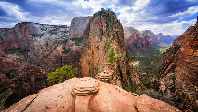 Angels Landing in Zion National Park, Utah, is at the top of the red sandstone cliffs in the centre of the picture and provides sweeping views of Zion Canyon.