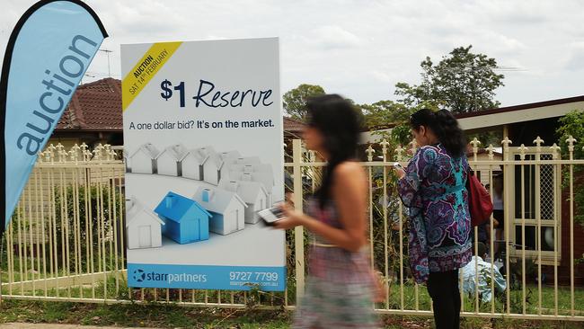 BLACKTOWN, AUSTRALIA - FEBRUARY 14: A sign stands on display before the home auction for a four-bedroom house at 230 Blacktown Road on February 14, 2015 in Blacktown, Australia. The Blacktown home sold for AUD$565,000 at auction today, smashing the reserve set at AUD$1. The Sydney home auction clearance rate is expected to remain high following the Reserve Bank's interest rate cut to 2.25 per cent last week. (Photo by Mark Metcalfe/Getty Images)