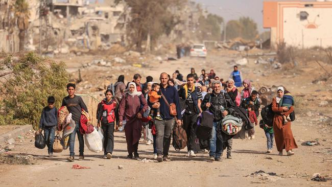 Palestinians fleeing the north walk along the Salaheddine road in the Zeitoun district on the southern outskirts of Gaza City. Picture: Mahmud Hams/AFP