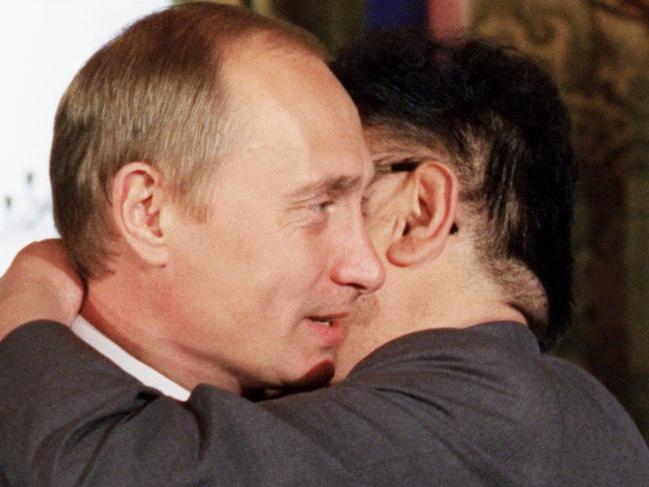 04/08/2001 Russian President Vladimir Putin, left, hugs North Korean leader Kim Jong Il during their meeting in the Moscow Kremlin.