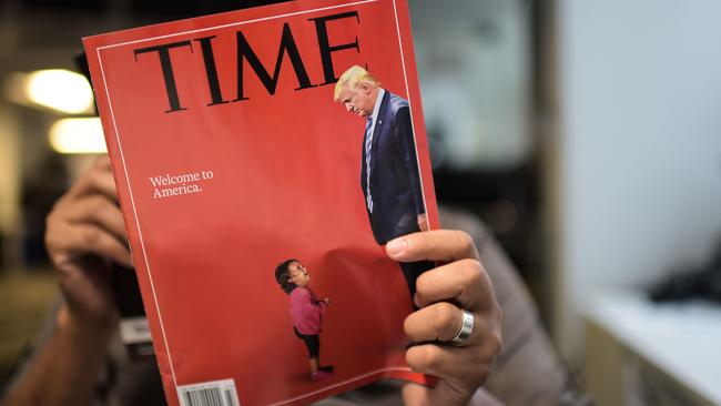 The cover of Time showing a crying child, who was later confirmed to have not been separated from her mother, and Donald Trump. (Pic: Eric Baradat)