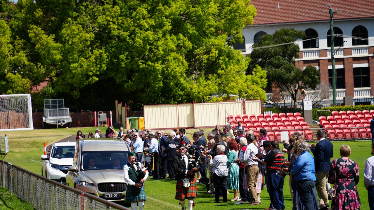 A lap of honour for John 'Cracker' McDonald at his funeral.