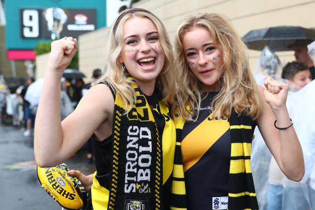 BRISBANE, AUSTRALIA - OCTOBER 24: Tigers fans pose before the 2020 AFL Grand Final match between the Richmond Tigers and the Geelong Cats at The Gabba on October 24, 2020 in Brisbane, Australia. (Photo by Chris Hyde/AFL Photos/via Getty Images)