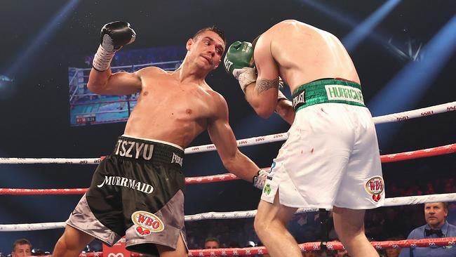 Tim Tszyu punches Dennis Hogan during the WBO Global Super Welterweight title at Newcastle. Picture: Cameron Spencer/Getty Images