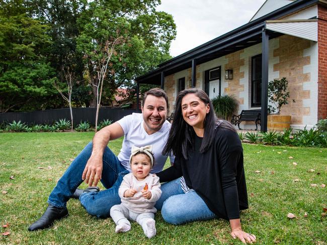 Alex and Rachel with baby Eva, 1, in front of the home they recently bought at Auction, on May 6th, 2021, in Hawthorn.Picture: Tom Huntley