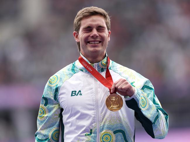 PARIS, FRANCE - SEPTEMBER 07: Gold medalist, James Turner of Team Australia, celebrates during the medal ceremony for the Men's 100m T36 Final on day ten of the Paris 2024 Summer Paralympic Games at Stade de France on September 07, 2024 in Paris, France. (Photo by Fiona Goodall/Getty Images for PNZ)